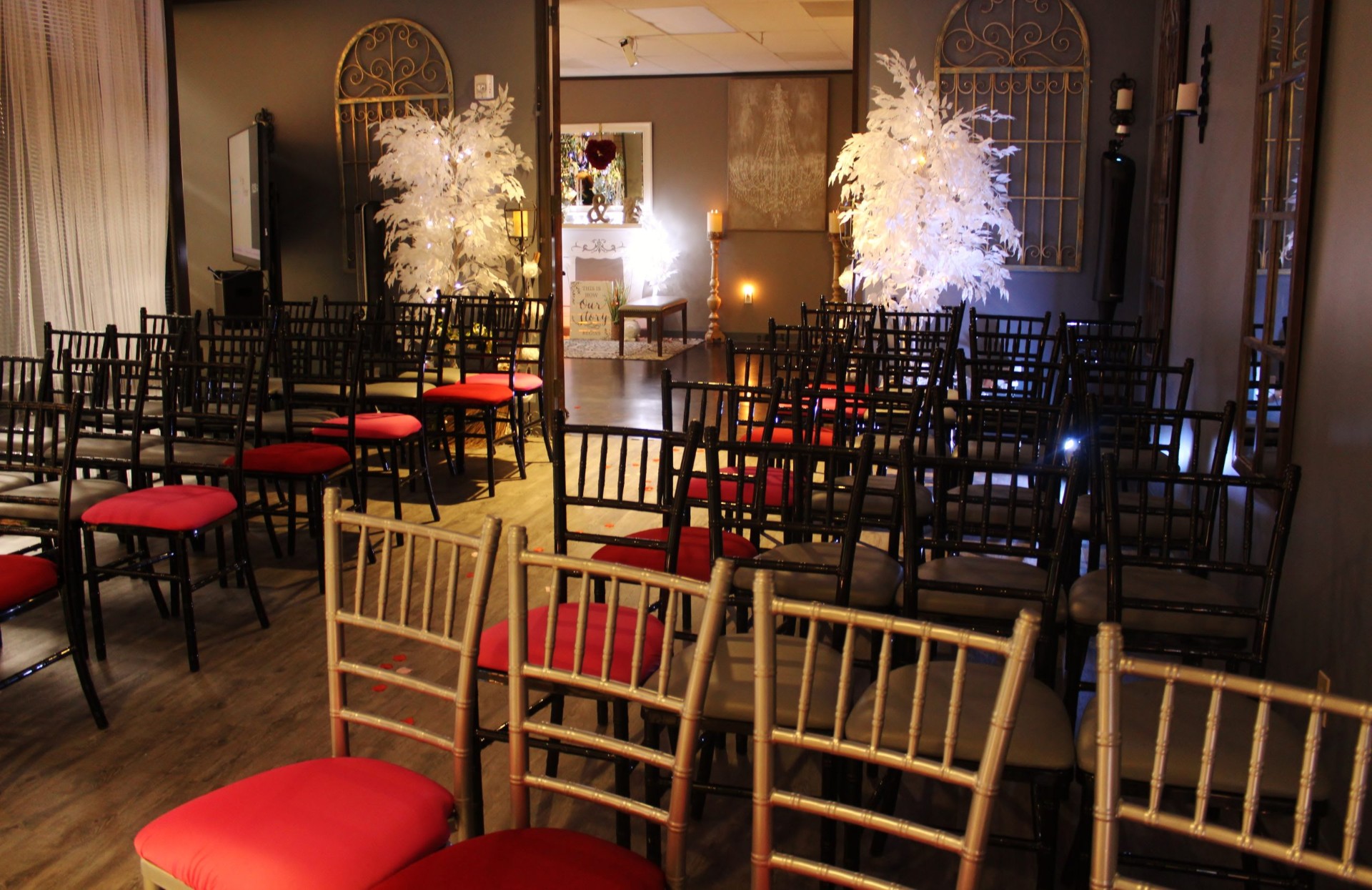 Chapel seating with illuminated trees and altar