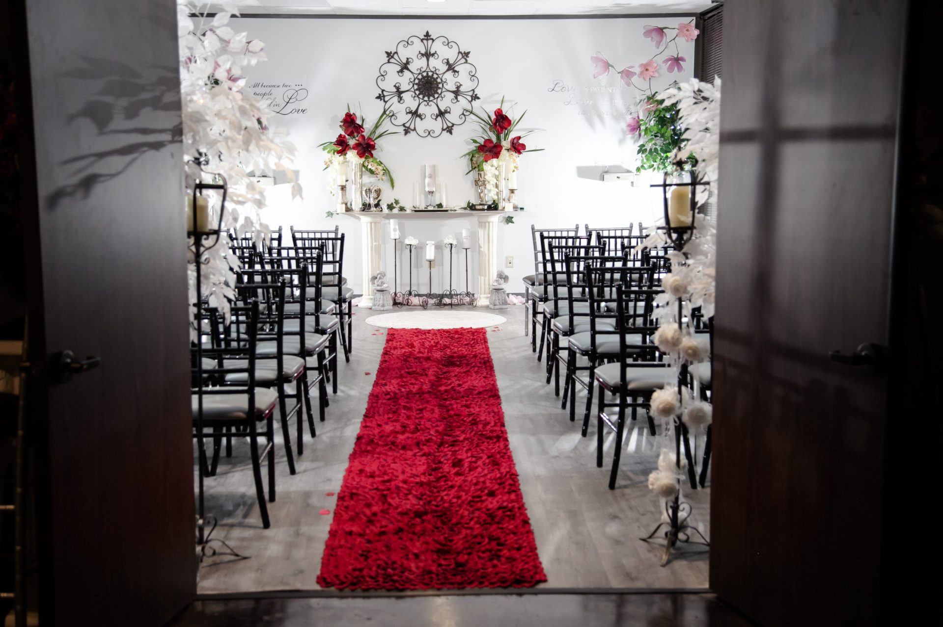 Chapel aisle with red carpet and altar view